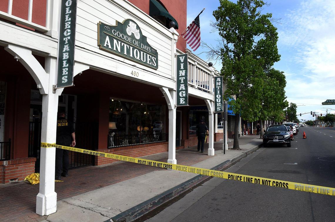 Police tape blocks off Clovis Avenue at Fifth Street, May 22, 2021, from the crime scene down the block at The Palace, where two men were shot, and one wounded, early Saturday morning.