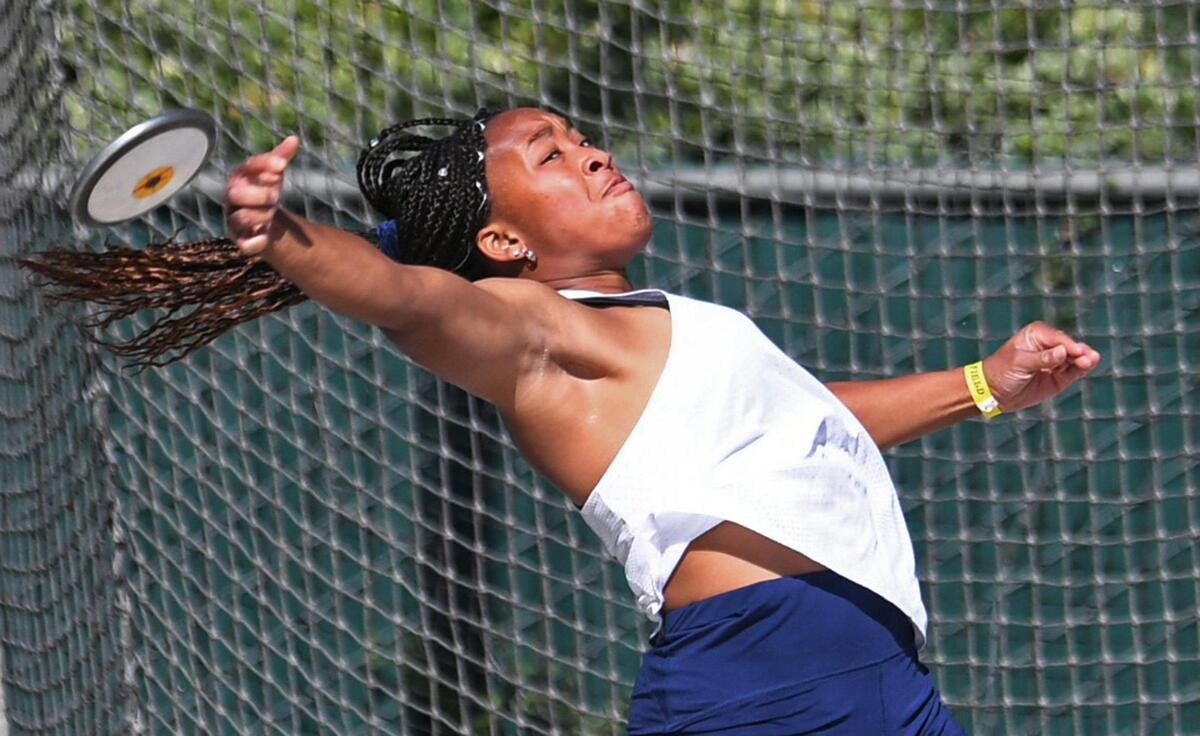 Clovis East’s Feyi Olukanni, throws in the Girls Discus at the CIF State Track and Field Championship finals Saturday, May 28, 2022 in Clovis.