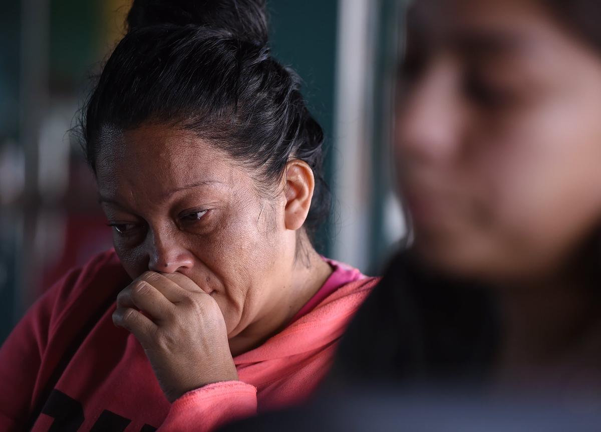 Moises Martinez’s mother, Teresa Ramos, left, is seen as Martinez’s fiancé, Juanita Barrita, sits to the right, Wednesday, Oct. 24, 2018 in Fresno.