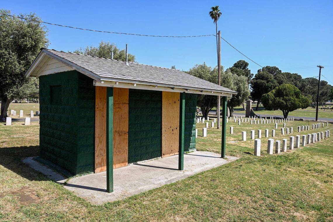 A building, presumably a former restroom, is shown with boarded up doors at the Veterans Liberty Cemetery on Friday, April 28, 2023.