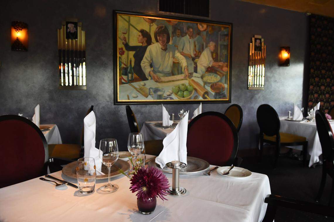 A dining room featuring a painting with founder Erna Kubin-Clanin and her daughter is pictured in this 2019 Fresno Bee file photo at The Elderberry House.