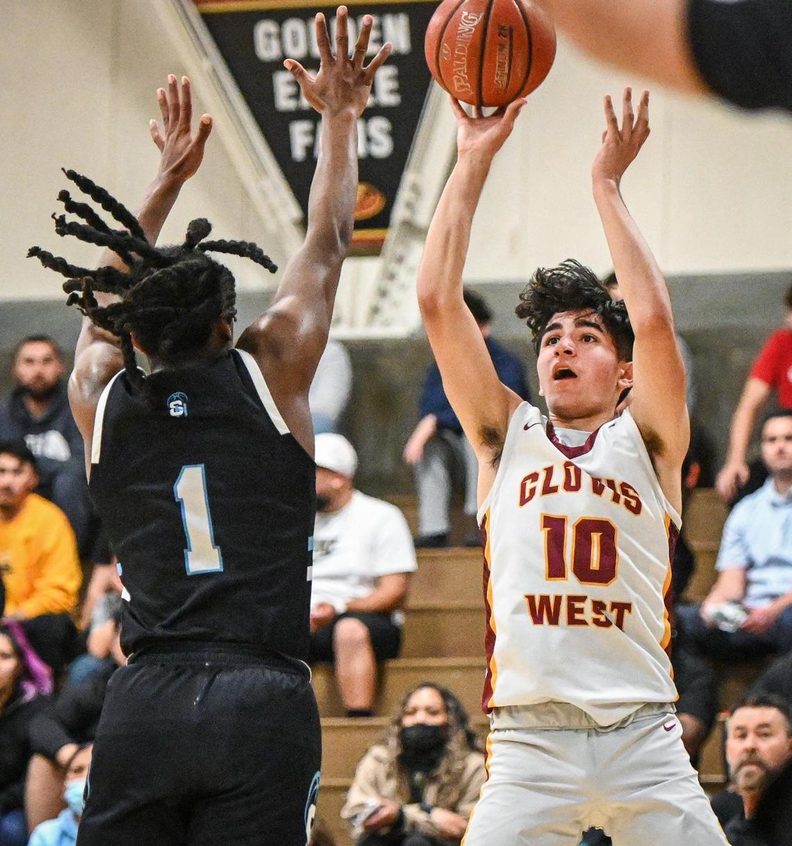 Clovis West’s Zach Chauhan, right, tries to float a jump shot over Sheldon’s Donovan Morgan during their CIF NorCal Open Division state playoff basketball game at Clovis West on Wednesday, March 2, 2022.