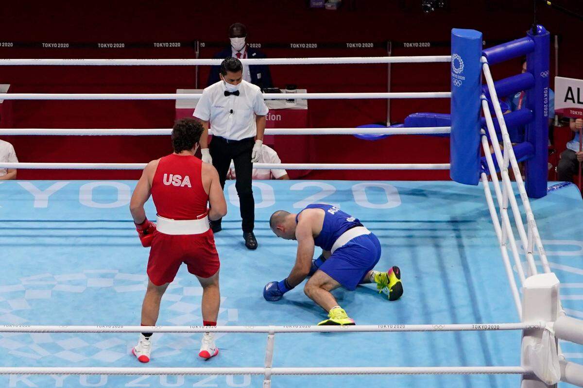 Richard Torrez Jr. from the United States,left, after knocking Algeria’s Chouaib Bouloudinats down during their men’s super heavyweight over 91-kg boxing match at the 2020 Summer Olympics, Thursday, July 29, 2021, in Tokyo, Japan.