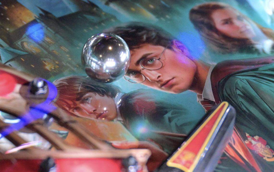 The ball rolls towards a flipper on a Harry Potter-themed pinball machine during Fresno Flip or Fail Pinball Club's pinball pop-up held at Summer Fox Saturday, Dec. 6, 2025 in Clovis.