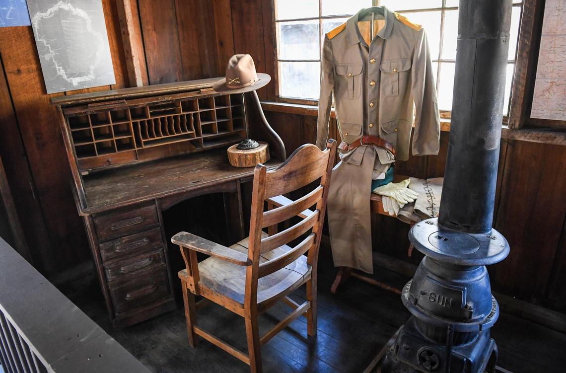 Artifacts including a period military hat and uniform are displayed in the Acting Superintendent’s Office building in the Yosemite History Center in Yosemite’s Wawona on Tuesday, Sept. 28, 2021. In the early 1900s, the building was used to house the commander of the military administration that operated the park in the years prior to the establishment of the National Park Service.