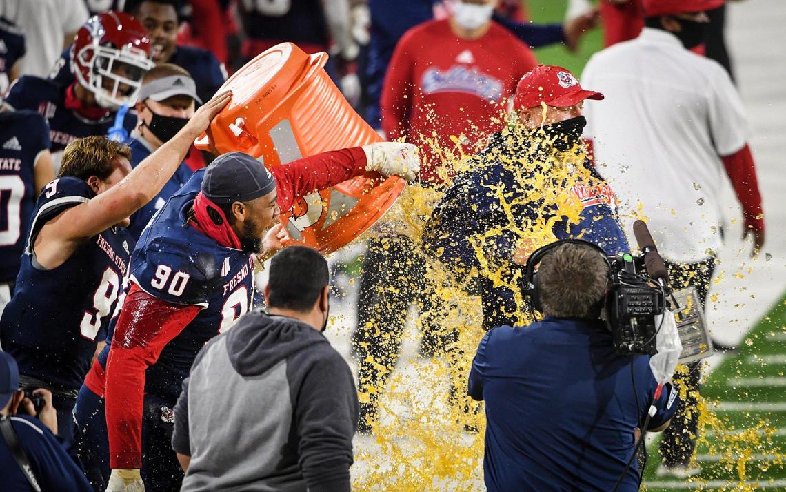 Fresno State head coach Kalen DeBoer gets a Gatorade bath after getting his first win against Colorado State at Bulldog Stadium on Thursday, Oct. 29, 2020.
