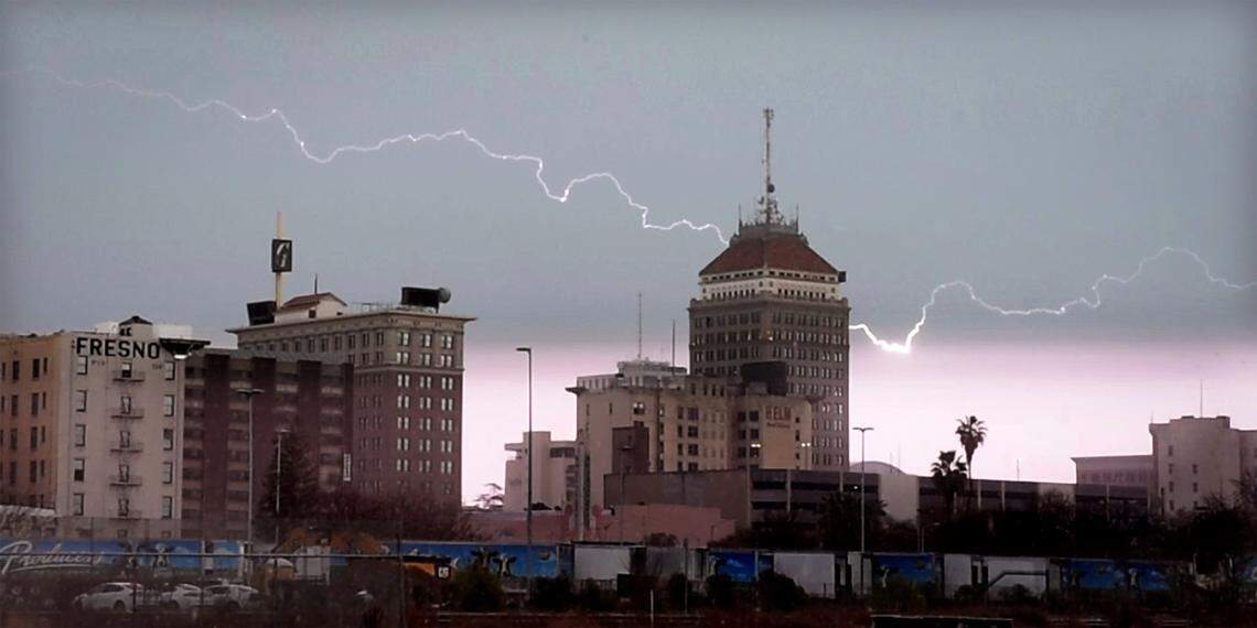 Lightning rips across the sky above Fresno’s skyline, during Wednesday’s storm, March 10, 2021, in a frame grab from video.