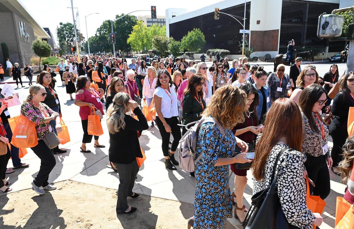 Attendees arrive to the 2022 Central California Women’s Conference Tuesday, Sept. 20, 2022 in downtown Fresno. Organizers estimated over 3,500 people attended.