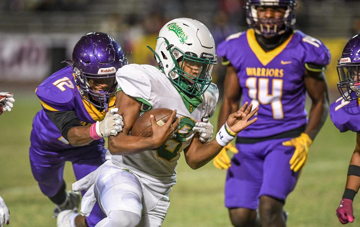 Roosevelt’s Michael Gonzales gets caught from behind by Fresno’s Jermaine Schexnayde during the 92nd annual Little Big Game between the two schools at Ratcliffe Stadium in Fresno on Friday, Oct. 28, 2022.