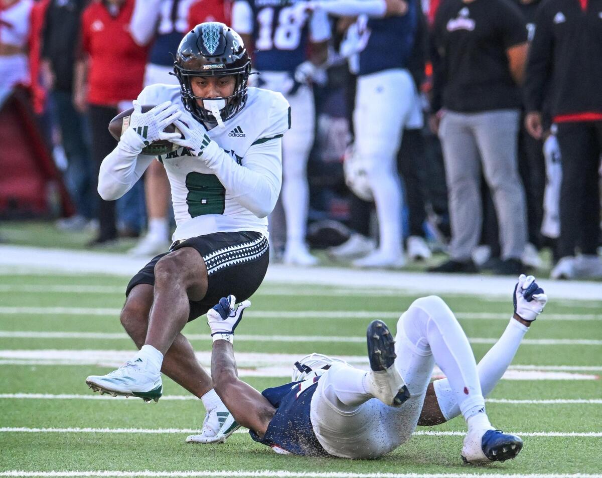 Fresno State’s Jakari Embry, right, tries to trip up Hawaii’s Tamatoa Mokiao-Atimalala after a completed pass during their game at Valley Children’s Stadium in Fresno on Saturday, Nov. 2, 2024.
