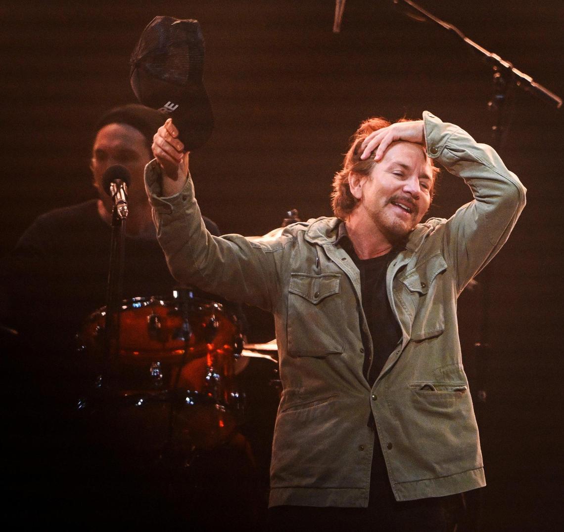 Eddie Vedder of Pearl Jam signals to the crowd while performing with the band during their North American tour stop at the Save Mart Center in Fresno on Monday, May 16, 2022.