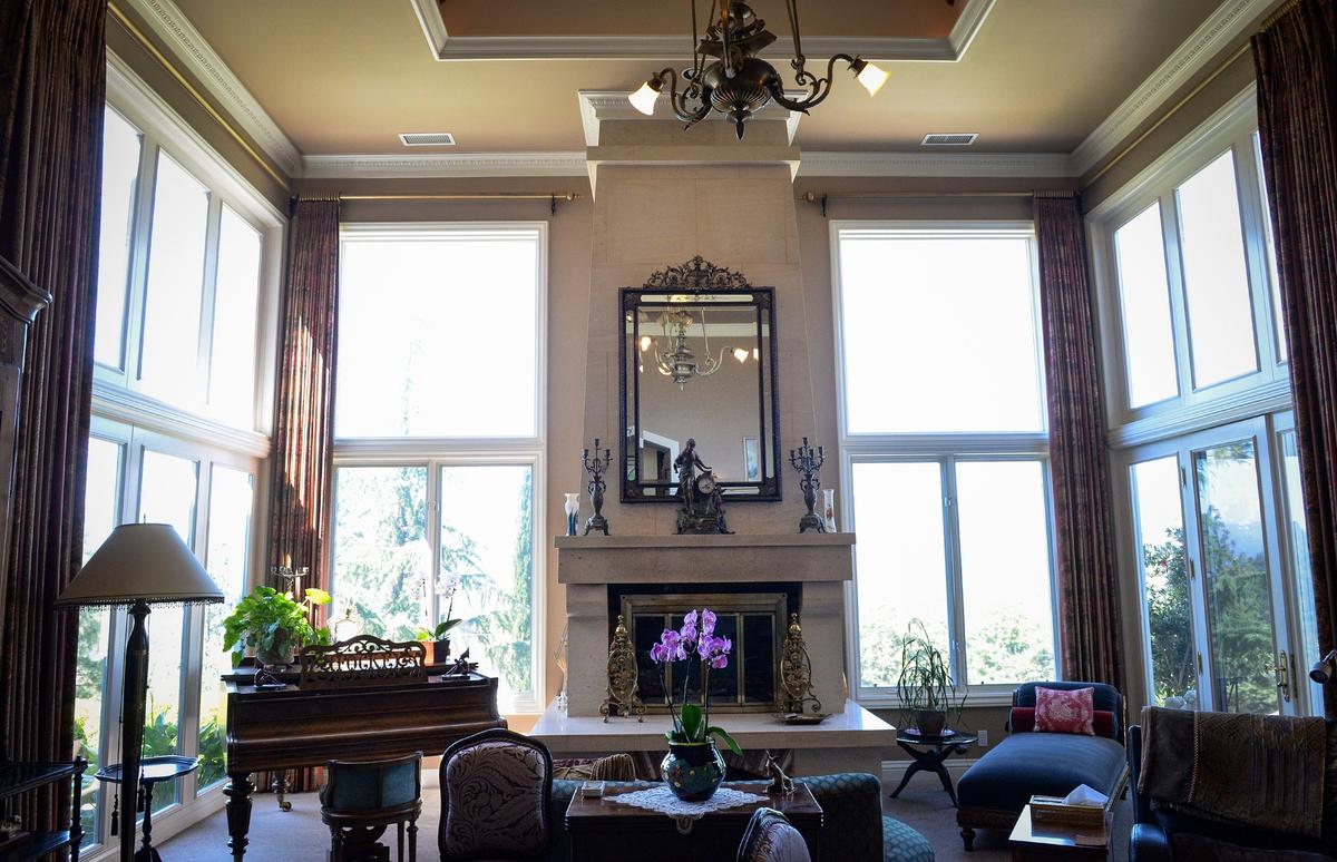 High ceilings and large windows look out toward the Sierra Nevada mountains in the front room of a European-style estate built in 1993 by Erna Kubin-Clanin, the former owner of Erna's Elderberry House, and her husband René Clanin.