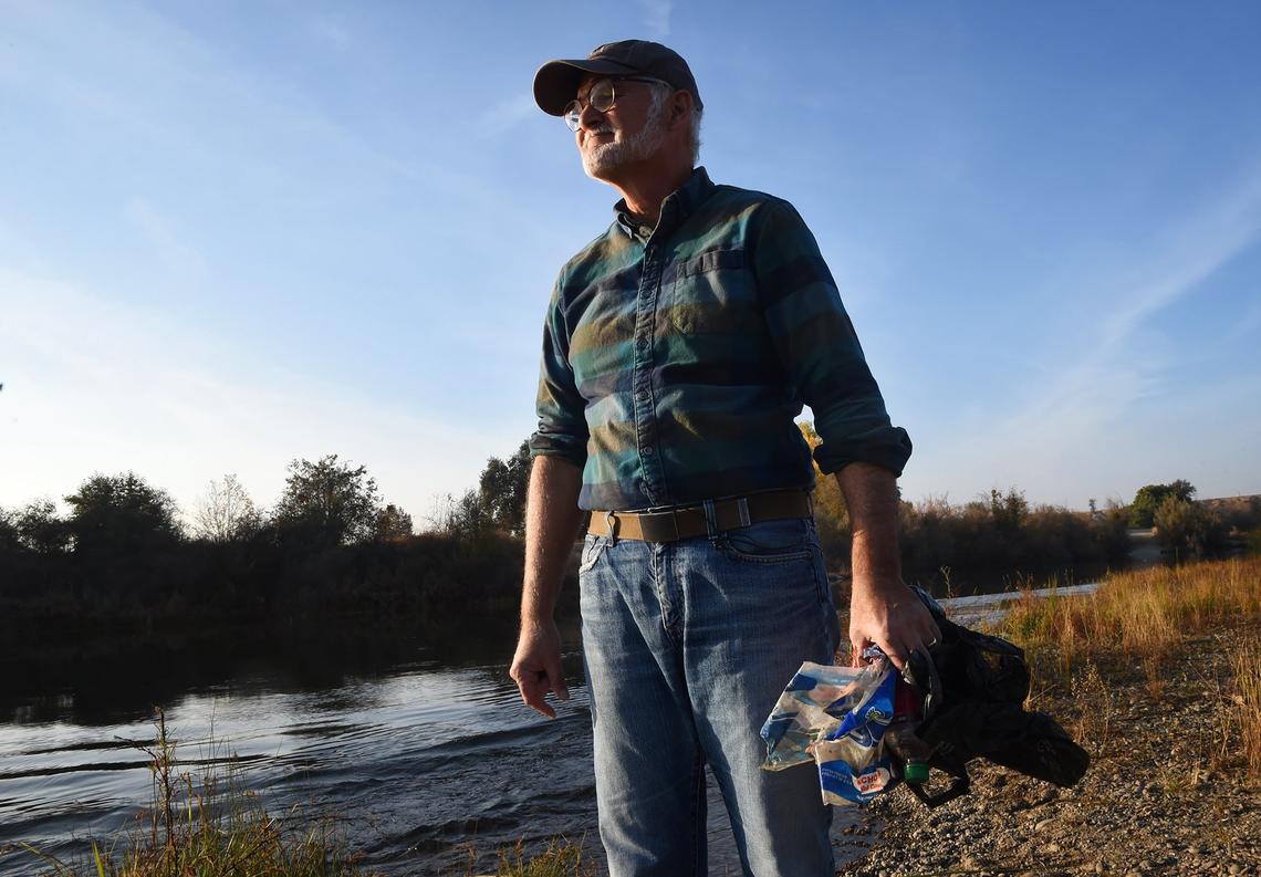 Fresno resident Tom Bohigian collects trash on the River West Open Space Area along the San Joaquin River Tuesday, Nov. 20, 2018. Bohigian started placing trash cans on the 508-acre property a year ago and collects the trash once a week.