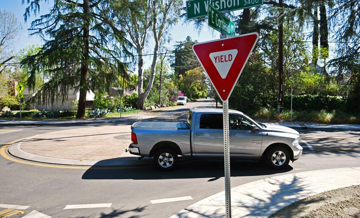 A pickup truck negotiates a roundabout along North Wishon Avenue at East Cortland Avenue on Thursday, March 12, 2026 in Fresno.