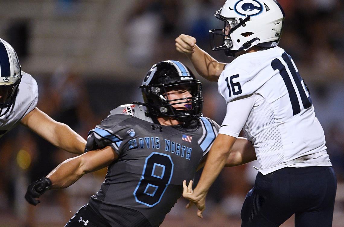 Clovis North’s Ross Cinfel, left, pressures CVC’s quarterback Nathan Peters in a game Friday, Sept. 13, 2024 in Clovis.