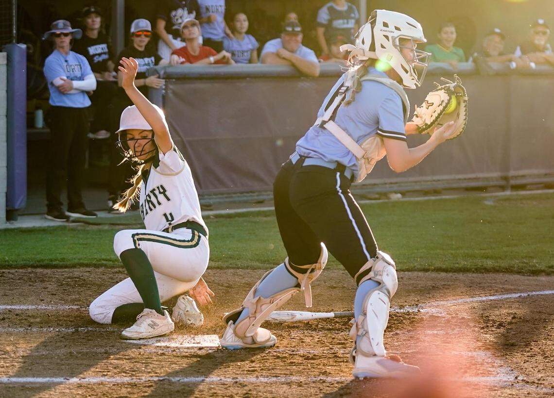 Paige Chapman (Liberty-Madera Ranchos) scores ahead of the throw to Camryn Pigott (Clovis North) during the County’s 12-5 victory over the City in the 40th City County All-Star Softball Game on June 15 at Washington Union High in Easton.