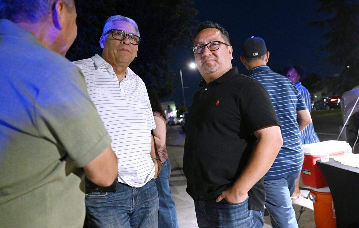 Fresno City Council District 1 candidate Rob Fuentes, right, is seen at a campaign gathering Tuesday night, June 2, 2026 in Fresno.