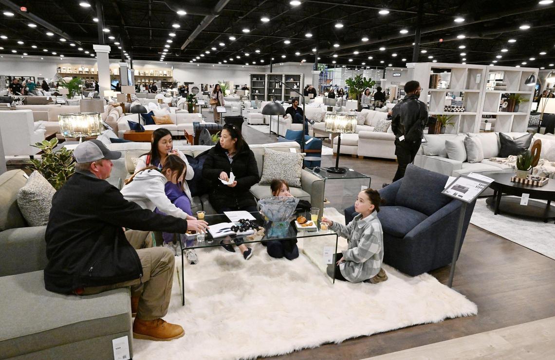 A family enjoys a living room selection during Friends & Family night for Living Spaces, a new furniture store in north Fresno Wednesday, Feb. 5, 2025. The expansive showroom includes a childrens play area and cafe serving family-friendly food plus beer and wine for adults. The grand opening is 10 a.m. Friday, Feb. 7, 2025.