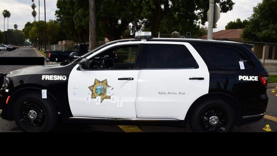 A patrol car in which a Fresno police sergeant was sitting when a suspect opened fire on Saturday, Oct. 28, 2024, shows several bullet holes, according to police.