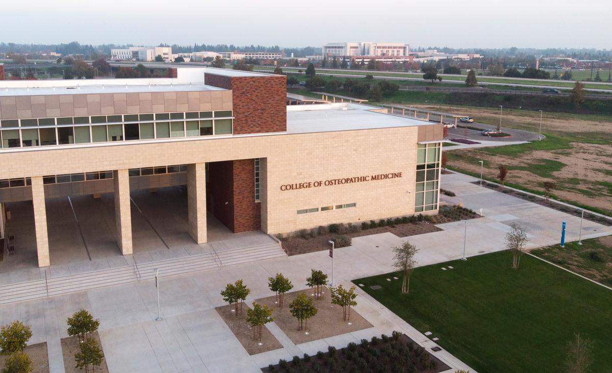 A drone photo showing a portion of California Health Sciences University, with Clovis Community Medical Center in the far background and Freeway 168 in between. Photographed Nov. 30, 2021 in Clovis.