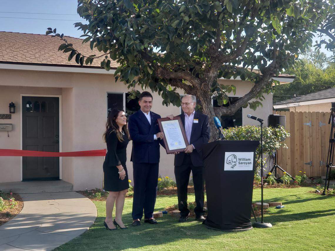 From left, Fresno City Councilwoman Esmeralda Soria, founder of Renaissance Cultural and Intellectual Foundation Artur Janibekyn and Fresno Mayor Lee Brand open the William Saroyan House Museum on Friday, Aug. 31, 2018.