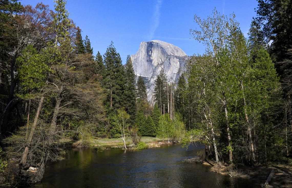 Yosemite National Park’s famous Half Dome comes into view from Sentinel Bridge on a spring day on Friday, April 23, 2021.