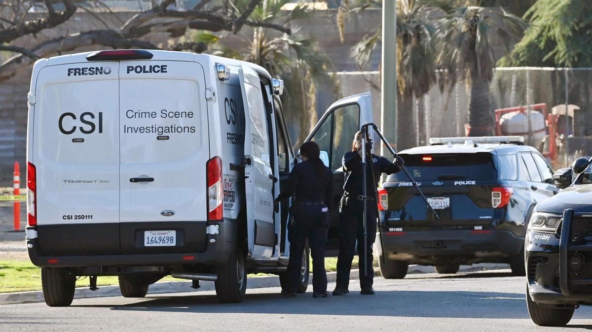 Investigators arrive behind Storyland in Roeding Park Thursday, Nov. 21, 2024 in Fresno. Police said a man died of a heart attack under suspicious circumstances.