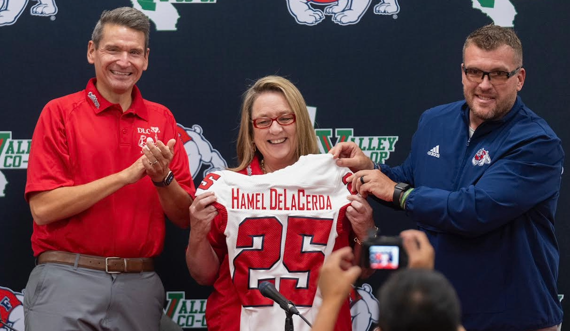 Jami Hamel DeLaCerda, center, donated $1 million to the Fresno State football program. Hamel DeLaCerda, founder of the Diamond Learning Center in Clovis, is flanked by athletics director Garrett Klassy on the left and football coach Matt Entz on the right.