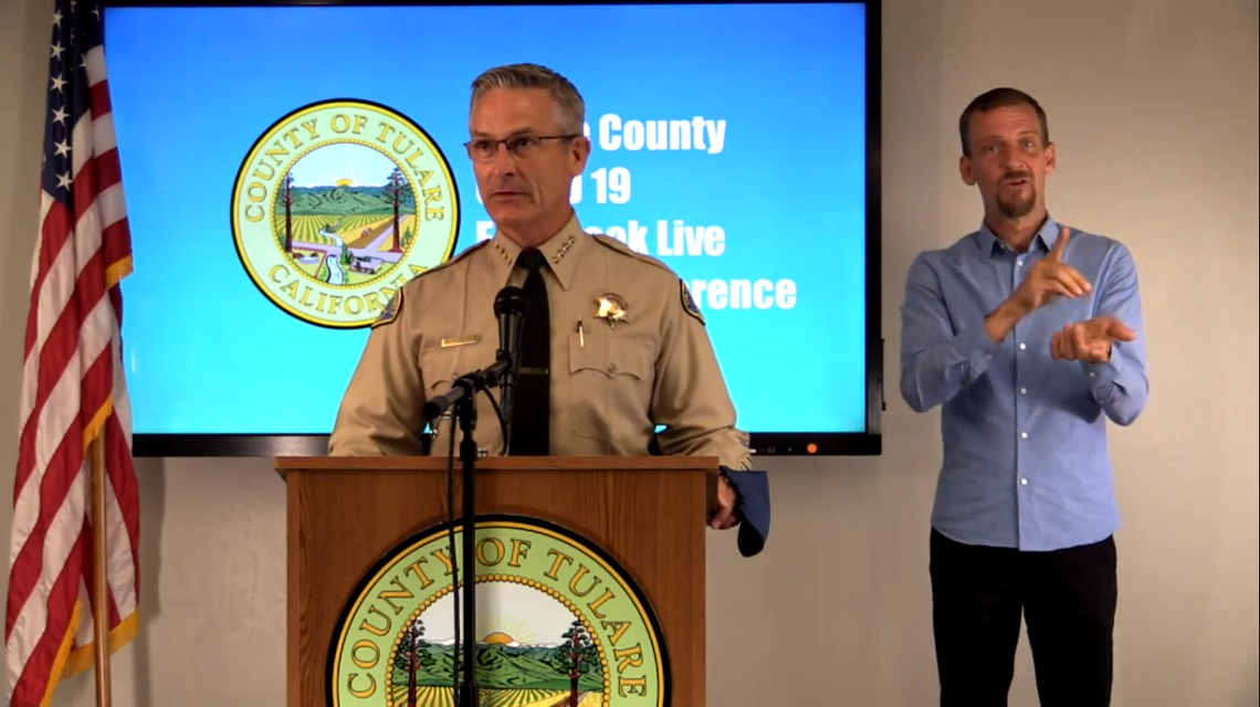 Screenshot of Tulare County Sheriff Mike Boudreaux with a sign language interpreter behind him during a news conference about COVID-19 in Tulare County on July 3, 2020 that was broadcast on Facebook live.