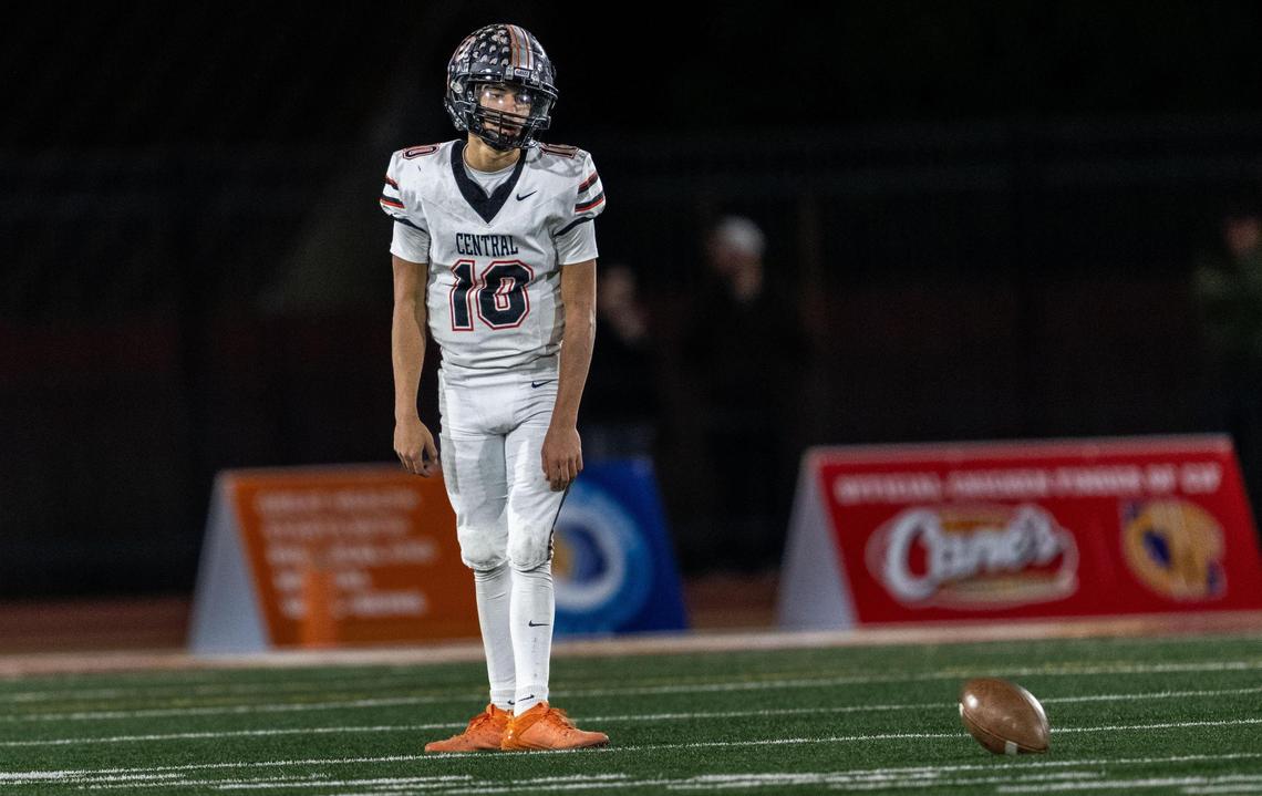 The Central Grizzlies’ Jelani Dippel (10) stands near the ball after he was sacked in the final seconds during the CIF State Division 1-A championship game against the Edison Chargers at Saddleback College in Mission Viejo on Saturday.