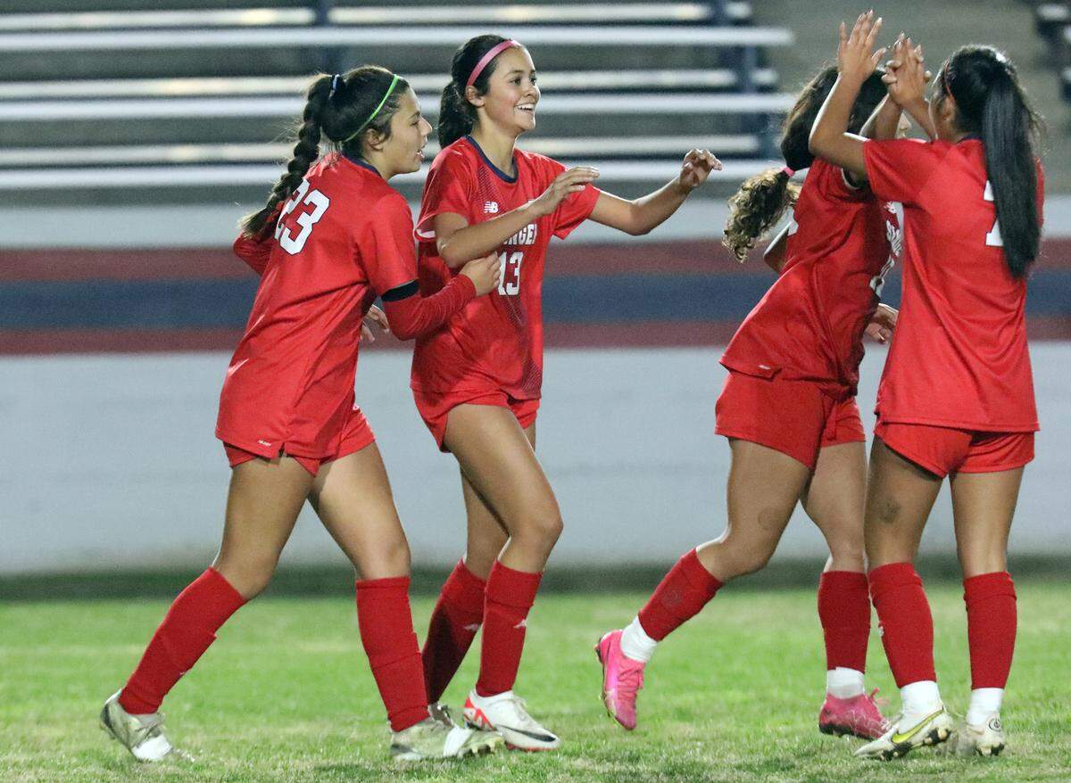 Sanger High freshman midfielder Veva Vaca (No. 13) celebrates a first-half goal during a 2-1 non-conference win over Clovis East at Tom Flores Stadium on Dec. 14, 2023.