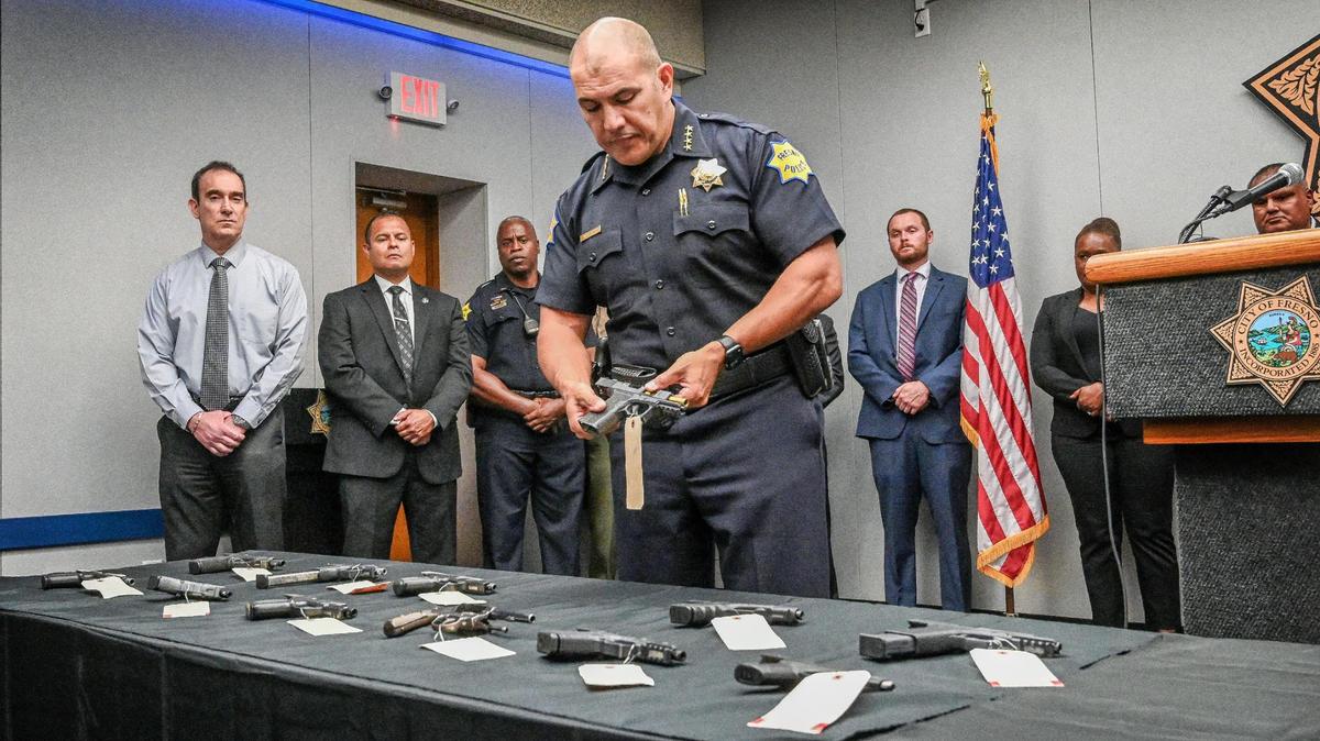 Fresno Police Chief Paco Balderrama holds up a ghost gun confiscated as part of the recent multi-agency Operation Safe Neighborhoods during a media press conference at the Fresno Police Department on Tuesday, May 24, 2022.