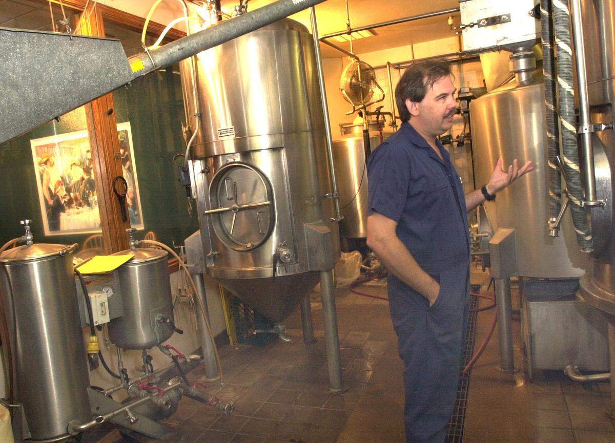 Shown in a file photo from August 2002, Kevin Cox — the brew master at Butterfields in the Tower District in Fresno — started out by making his own beer from his home, which later turned into a career for him.