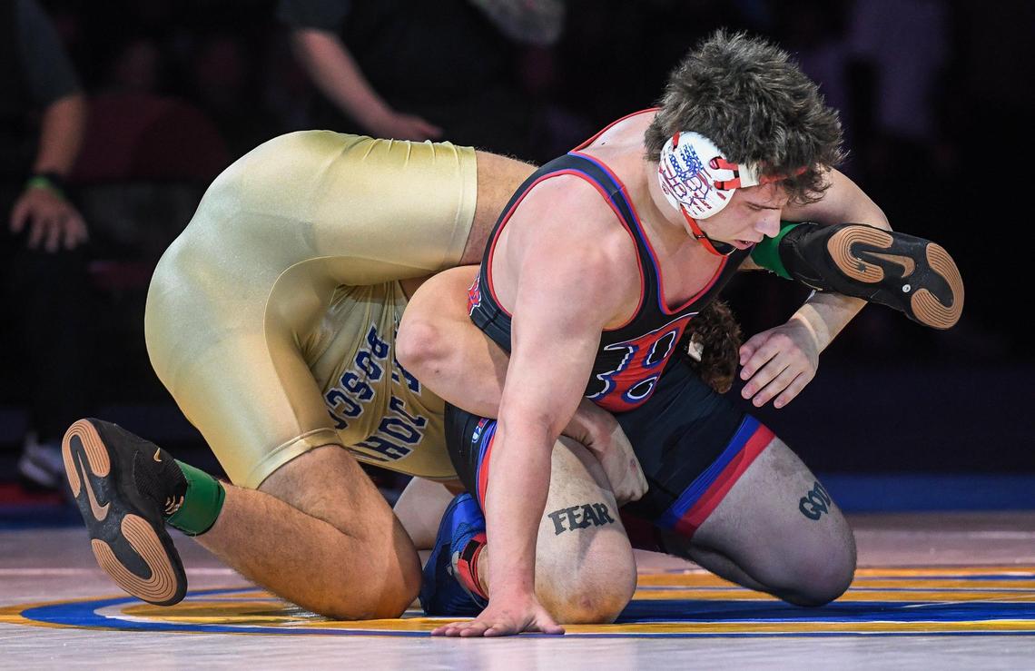 Buchanan’s Kannon Campbell, right, wrestles Nicholas Sahakian in the boys 220-pound CIF State Wrestling Championship match at Mechanics Bank Arena in Bakersfield on Saturday, Feb. 25, 2023. Campbell lost the bout and finished second overall.