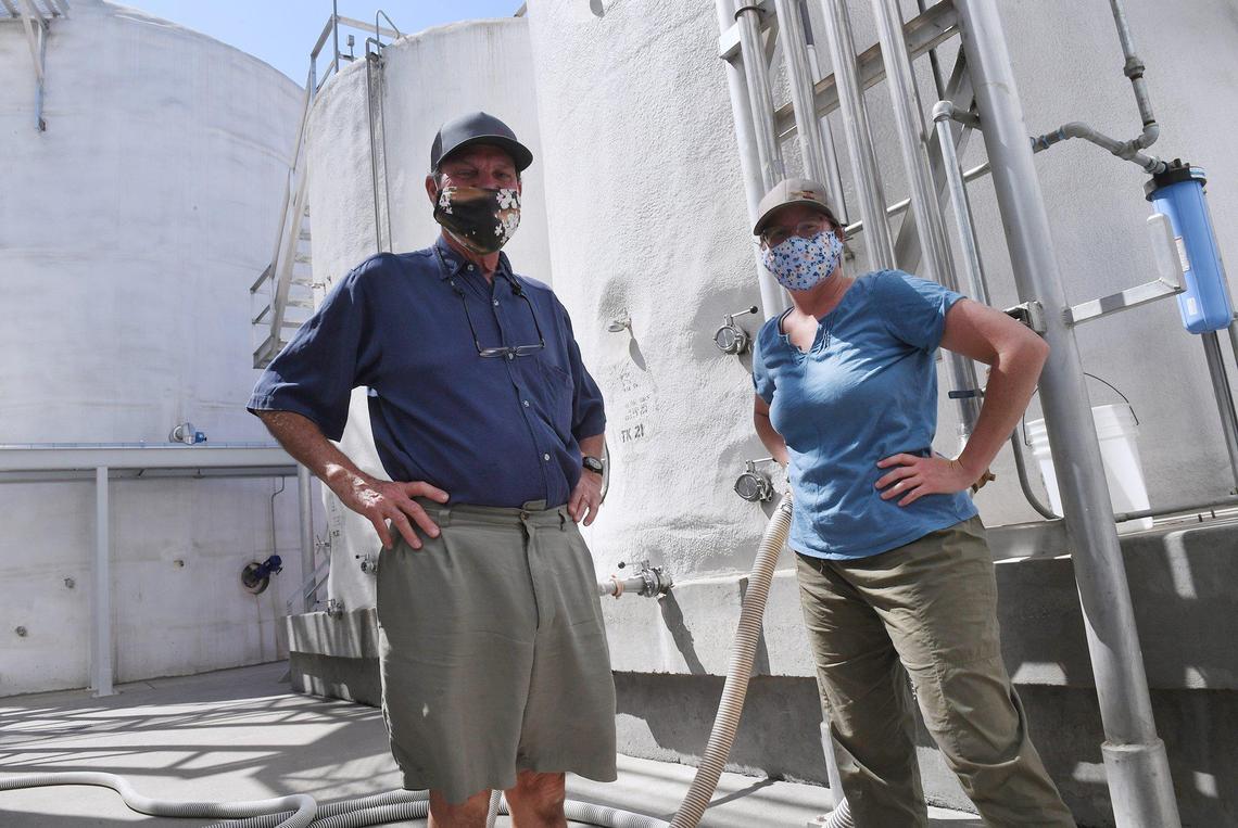Andy Quady, owner of Quady Winery, right, with his daughter Allie Quady, Manager of Health, Safety and Management, photographed Tuesday, Aug. 10, 2021 in Madera. Madera’s groundwater aquifer level is quickly falling posing a serious issue to businesses like Quady Winery in this drought.