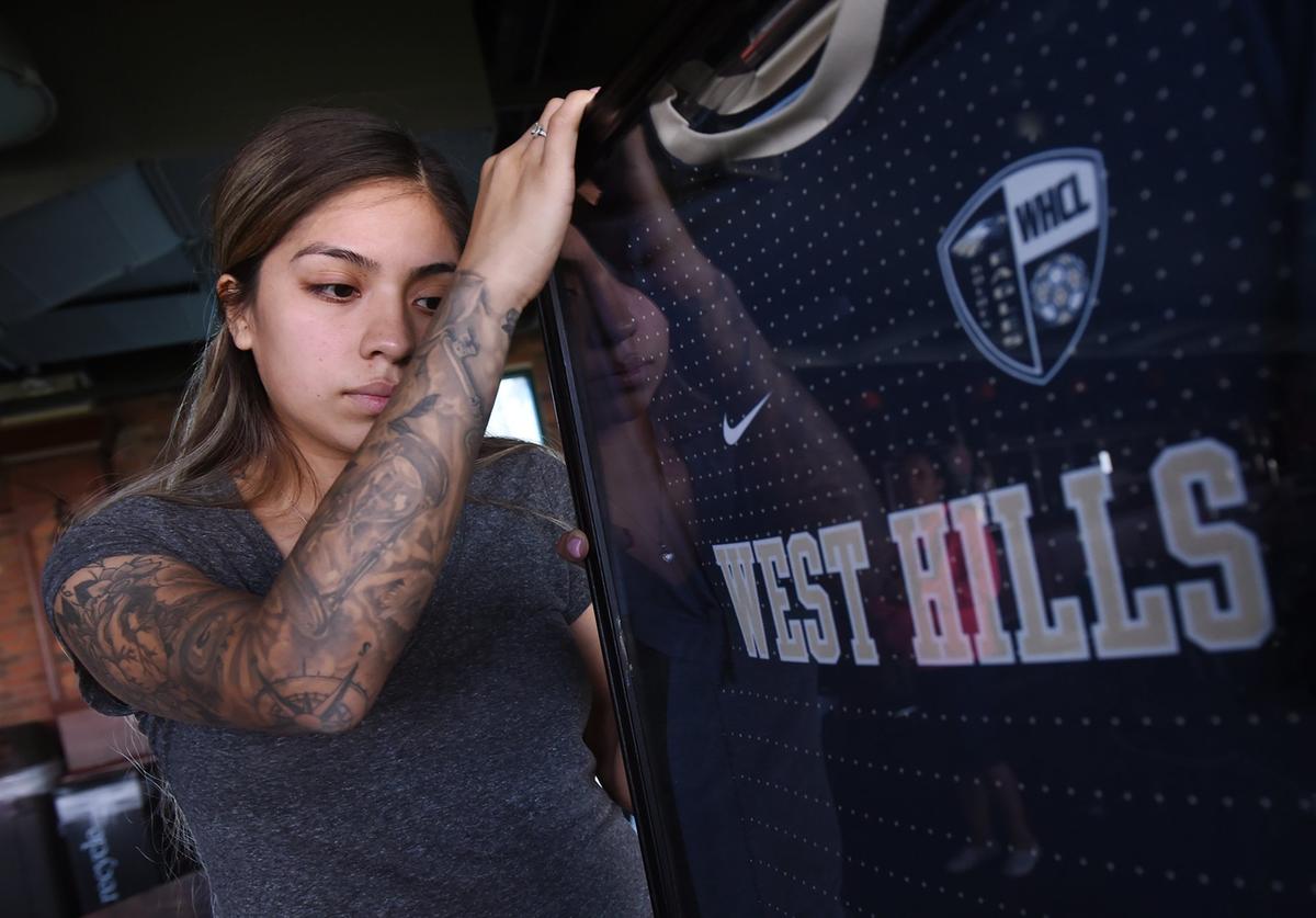 Juanita Barrita talks about her fiancé, Moises Martinez, a former West Hills College player who played for Fresno FC. Photographed Wednesday, Oct. 24, 2018 in Fresno.