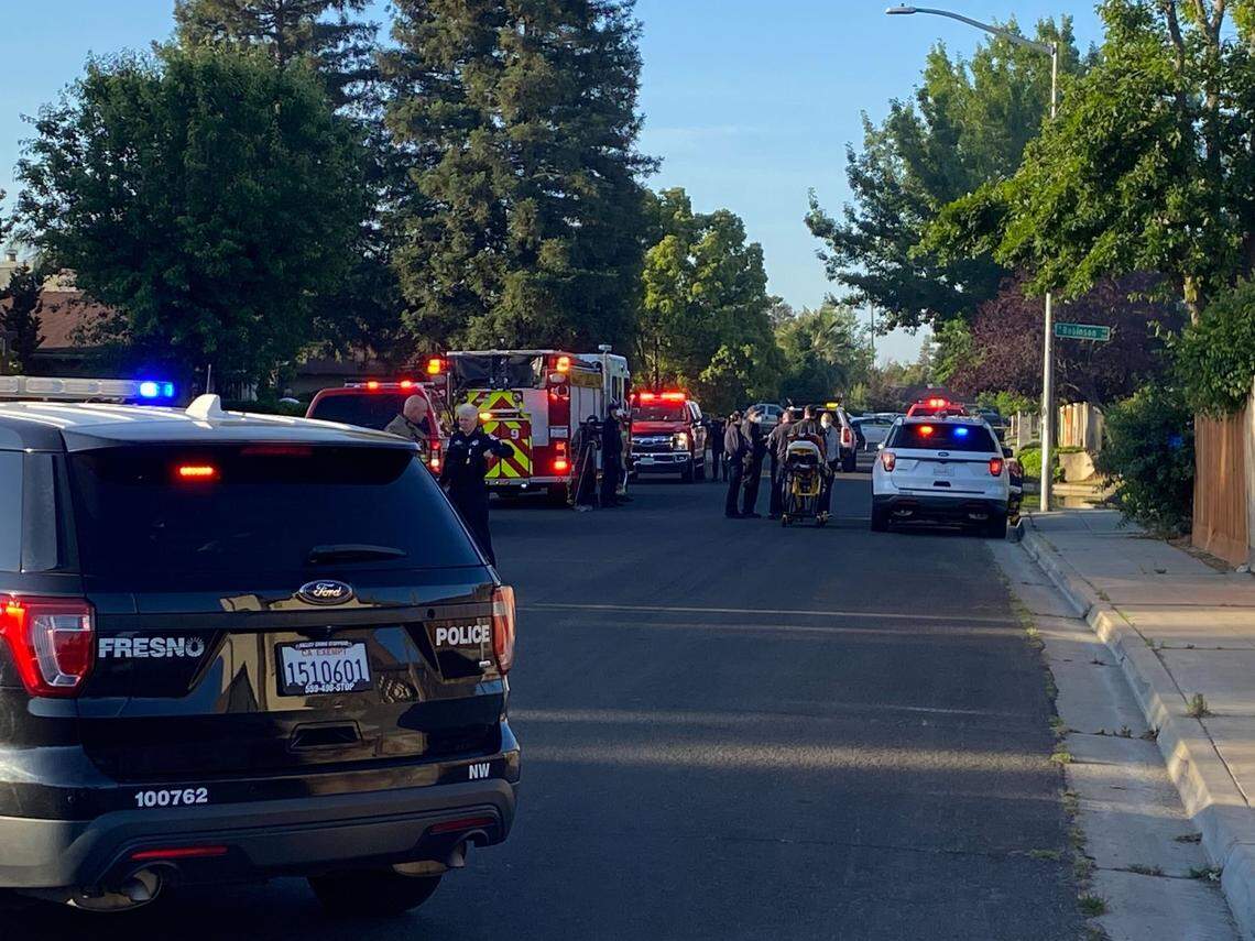 Emergency personnel respond to a house fire in the 3600 block of West Robinson Avenue on Tuesday morning, May 3, 2022.