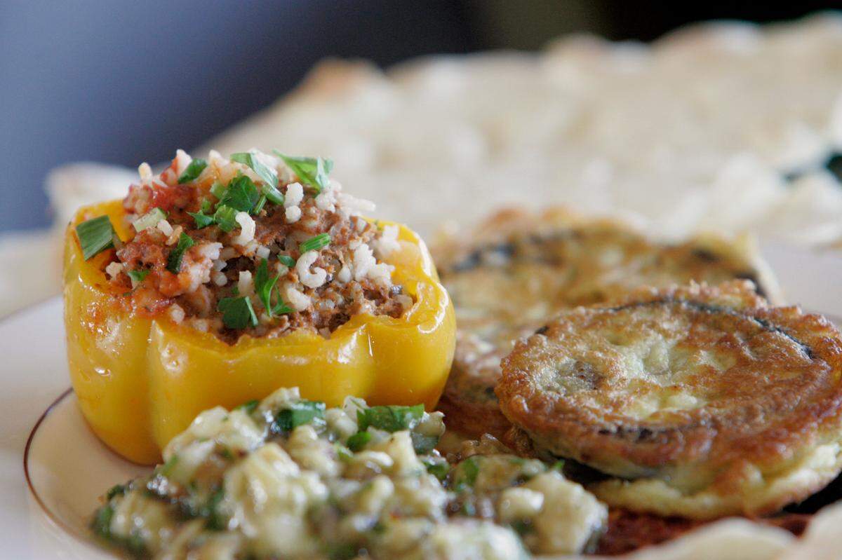 Harry Horasanian serves these traditional Armenian dishes at Uncle Harry’s in Reedley, including this stuffed pepper with fig salad, and fried eggplant served with cracker bread in this file photo from 2005.