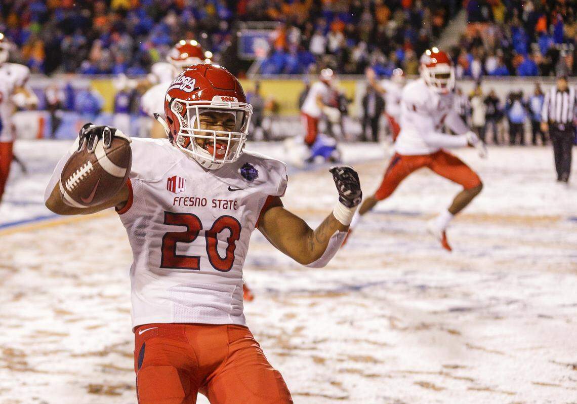 Fresno State running back Ronnie Rivers (20) celebrates the game winning touchdown against Boise State in overtime against in an NCAA college football game for the Mountain West championship, Saturday, Dec. 1, 2018, in Boise, Idaho. Fresno State won 19-16.