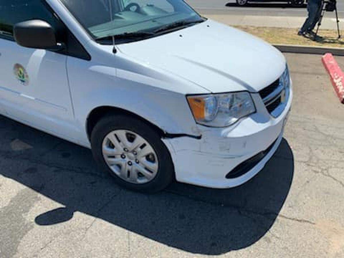 A County of Fresno van with front-end damage sits parked after sheriff’s deputies say it was stolen by a woman who then led officers on a chase Friday, June 25, 2021, in Fresno, California.