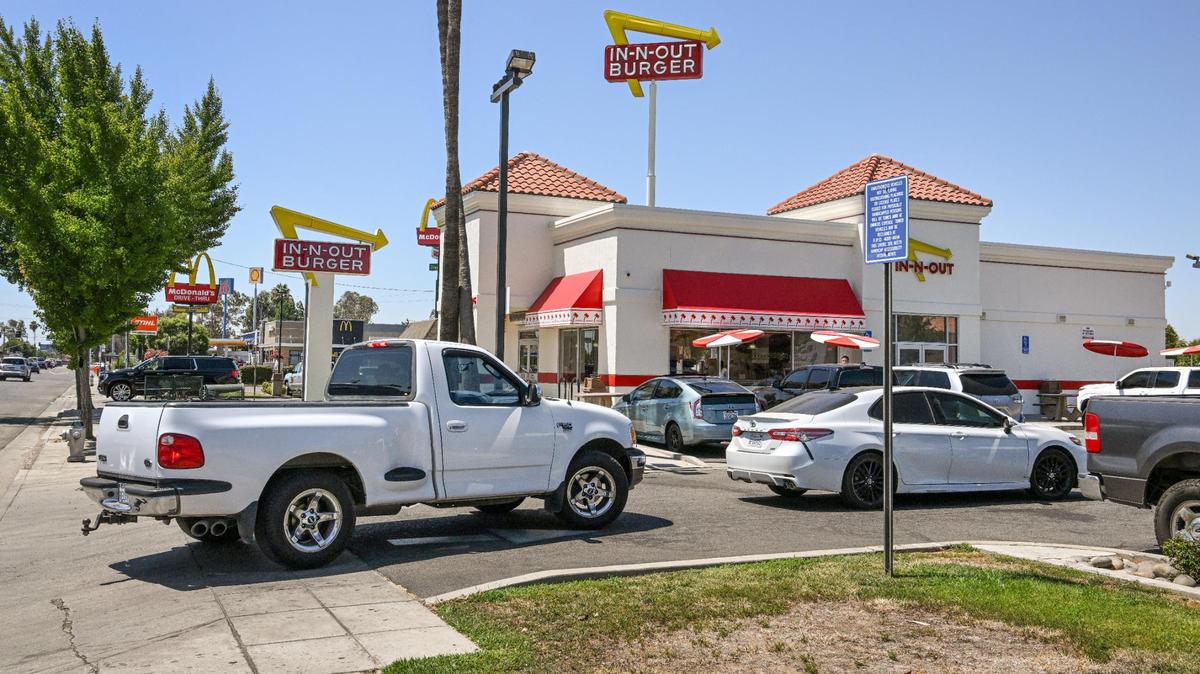 Cars are backed up into traffic while waiting to get to the drive-thru window at In-N-Out Burger in Fresno in August. Opening day for Idaho’s first In-N-Out promises to be a nightmare. You can probably wait a couple of days before checking it out.
