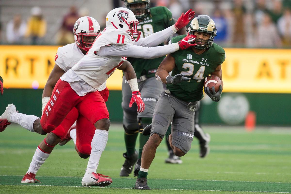 New Mexico linebacker Rhashaun Epting brings down Colorado State running back Izzy Matthews, right, during the Lobos’ 20-18 loss to the Rams at Canvas Stadium in Forth Collins, Colo, Saturday, Oct. 13, 2018. Epting is leading New Mexico with 5.5 tackles for loss.