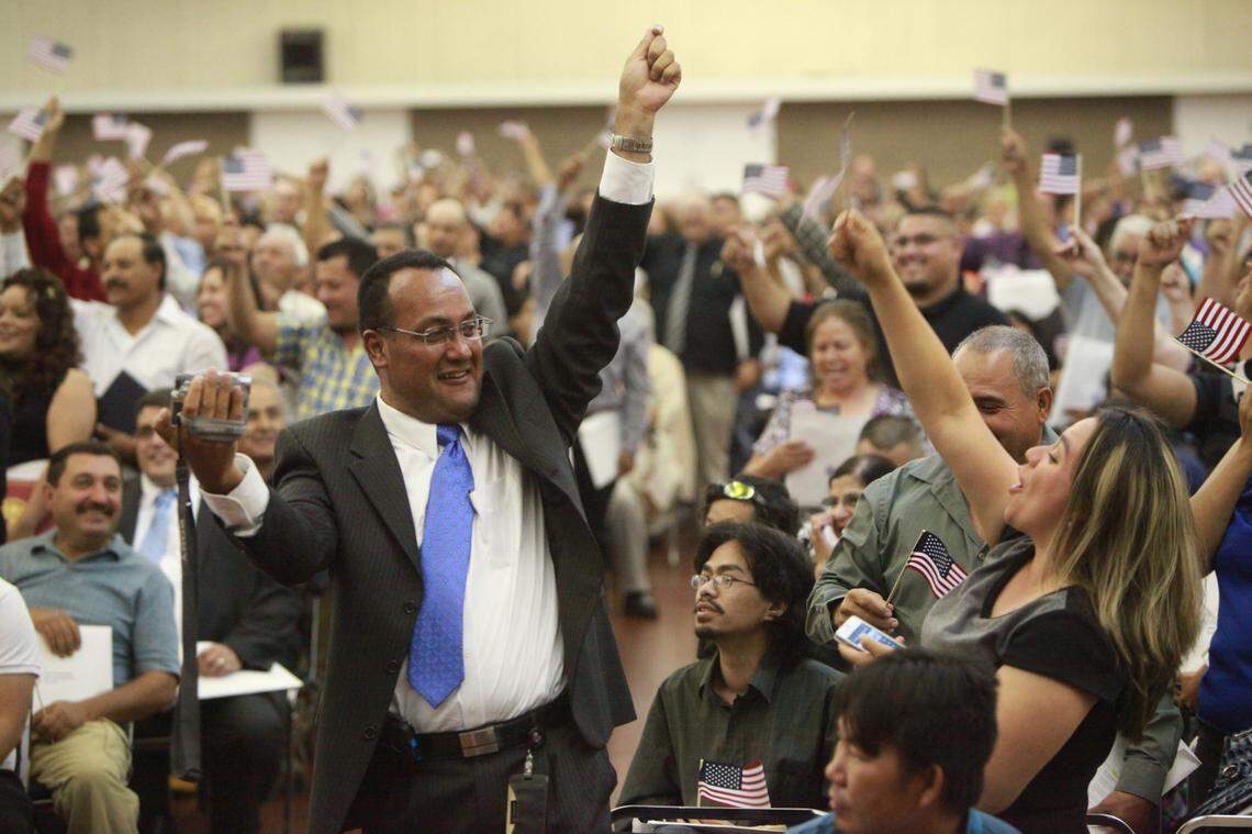 Former KFTV Channel 21 Univisión news anchor Francisco J. López Mireles was among 883 who became citizens at a June 2012 ceremony. Next to him is his wife Ireri Meza de López.