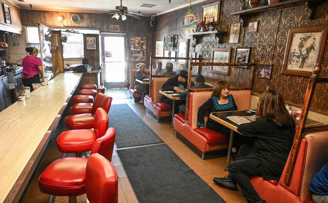 Margaret Sifuentes and her daughter Gina Daniels sit in a booth at right at their restaurant Cuca’s in Fresno’s Chinatown on Thursday, Dec. 14, 2023. The restaurant was originally opened by Sifuentes’ grandmother in 1973 and is turning 50 on Dec. 26.