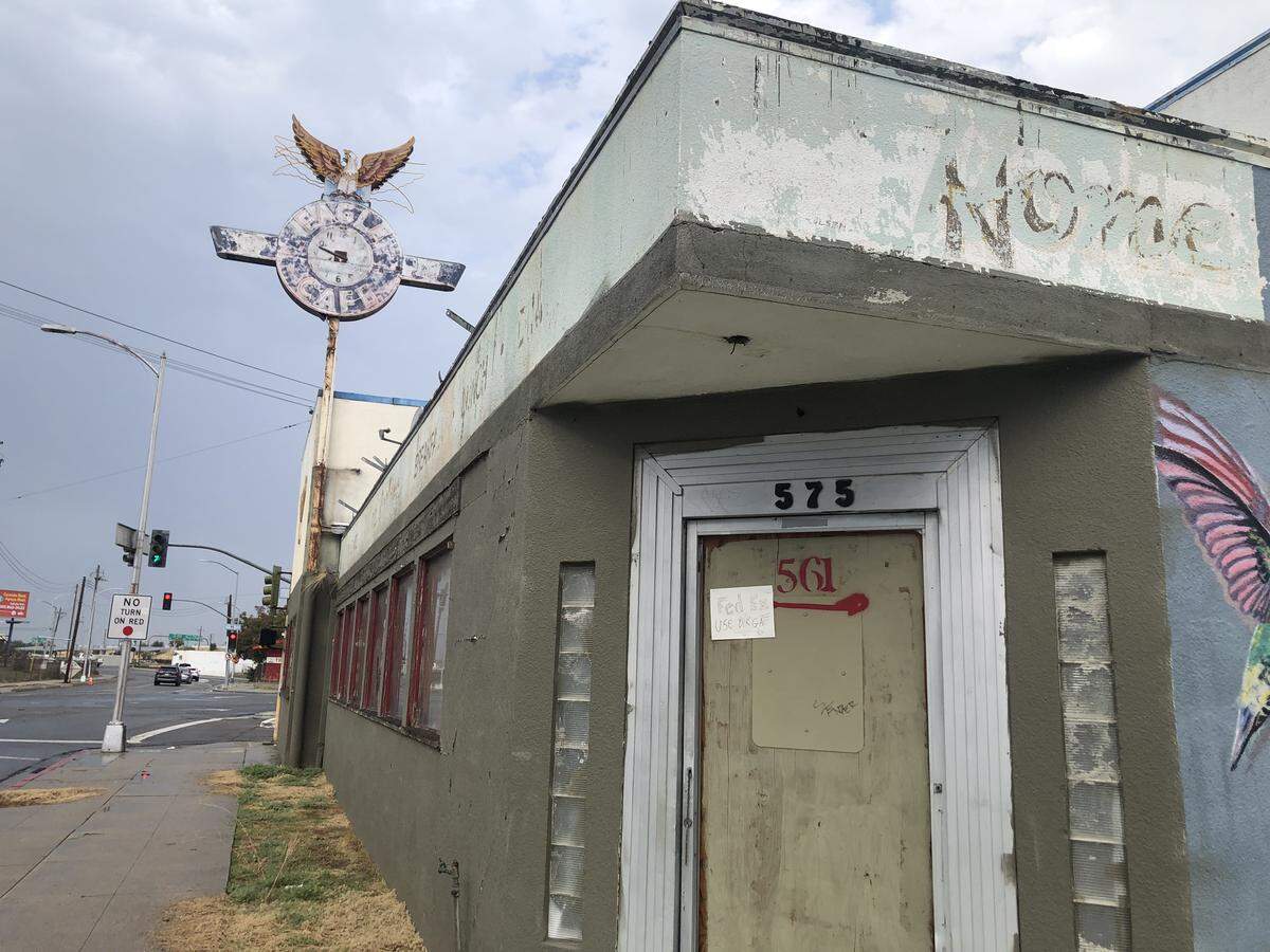 The Eagle Cafe, a once-bustling 24-hour diner in downtown Fresno, sits vacant at 575 Divisadero St., its neon clock tower weathered and emblematic of the Lowell Neighborhood’s past.