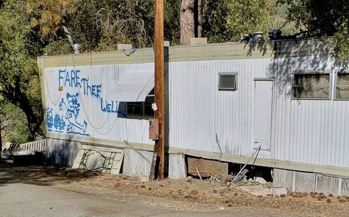 Cartoon animals and the message, “Fare thee well,” painted by former resident Chris Nishimura grace the side of one of the mobile homes that still remained in the El Portal Trailer Park in November 2022.