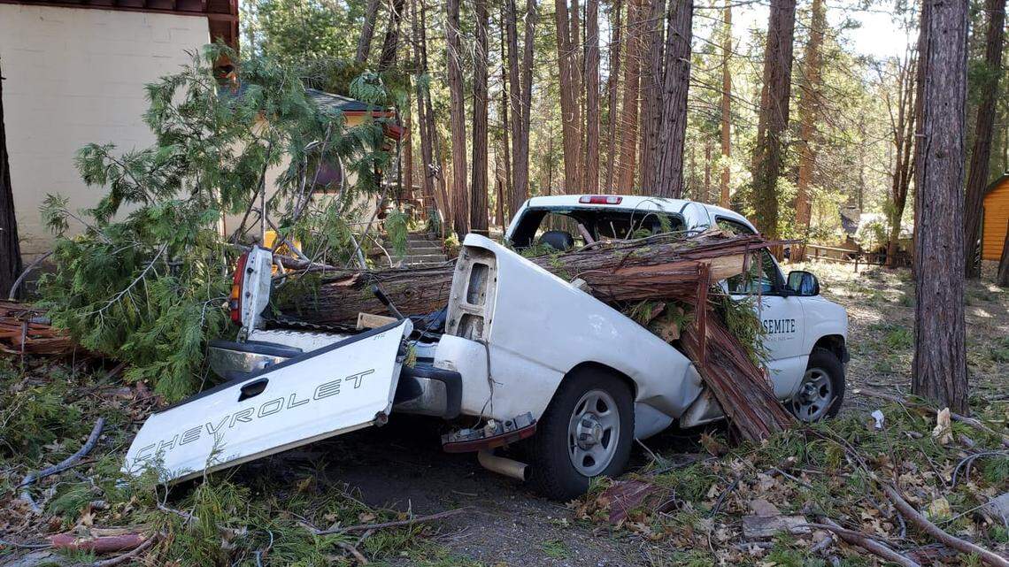 Yosemite National Park remains closed following a wind storm that toppled trees and damaged cars and buildings.