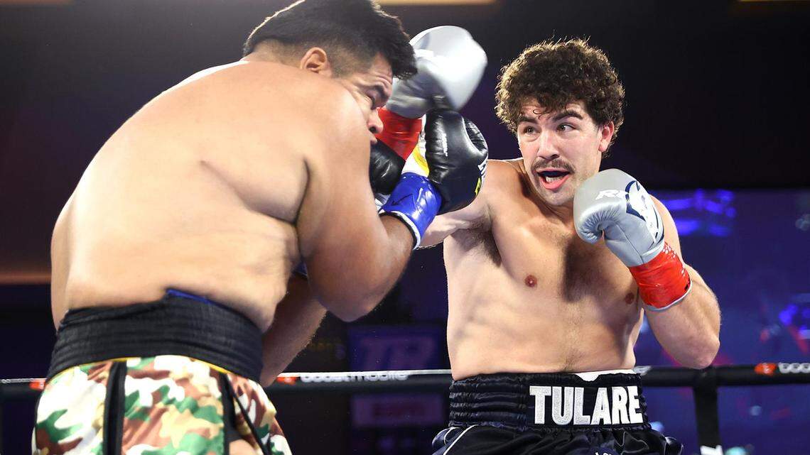 Roberto Zavala Jr (L) and Richard Torrez Jr (R) exchange punches during their heavyweight fight on July 15, 2022 in Temecula, California.