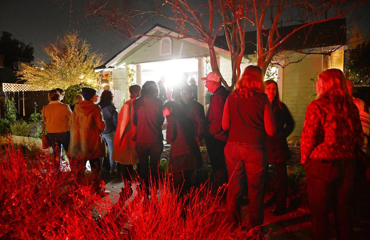 A group waits in line to tour The Peace Home during the 2024 Fresno High Neighborhood Holiday Home Tour Monday evening, Dec. 2, 2024 in Fresno.