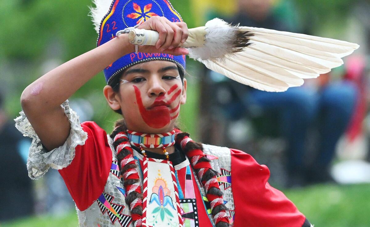 Jingle dancer Jaedyn Le Grant from the Chukchansi tribe dances in front of local families and relatives gathered at Fresno State’s Peace Garden to mark Missing and Murdered Indigenous Women and Girls’ Day, Friday, May 5, 2023 in Fresno.